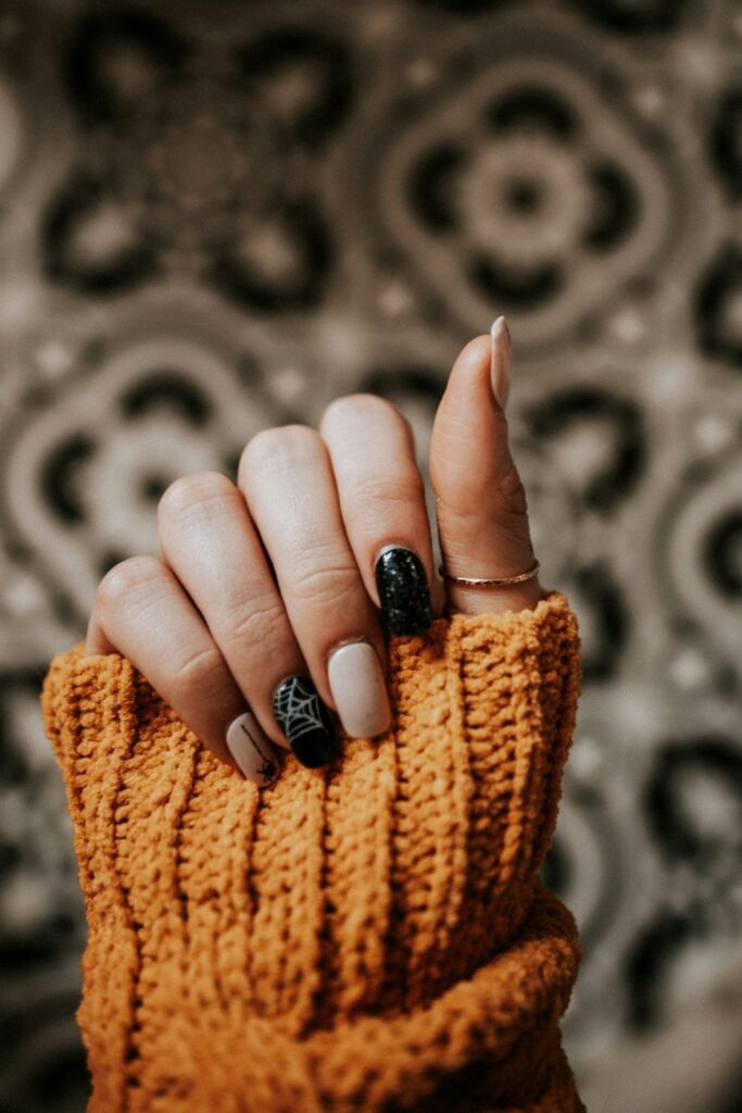 10 Easy Nail Art Ideas for Beginners You Can Try at Home 7 Easy Nail Art featuring nude and black nails with glossy dark decorative accents.