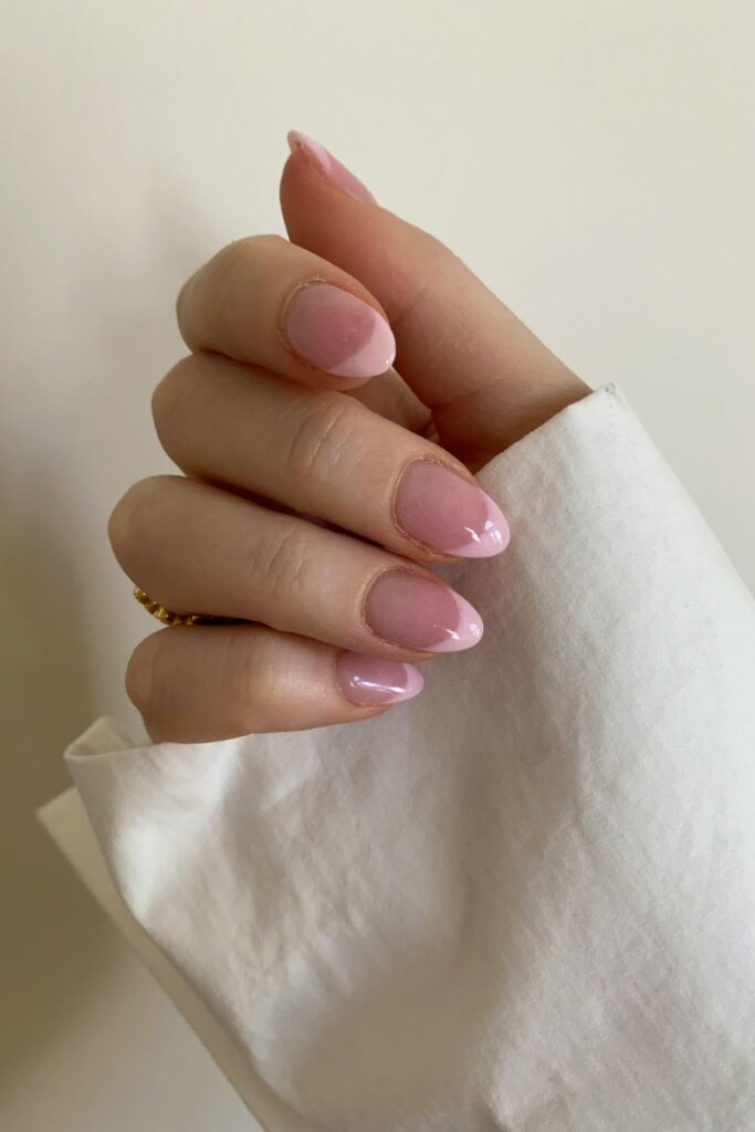 10 Easy Nail Art Ideas for Beginners You Can Try at Home 9 Easy Nail Art featuring glossy light pink almond-shaped nails with a natural finish.
