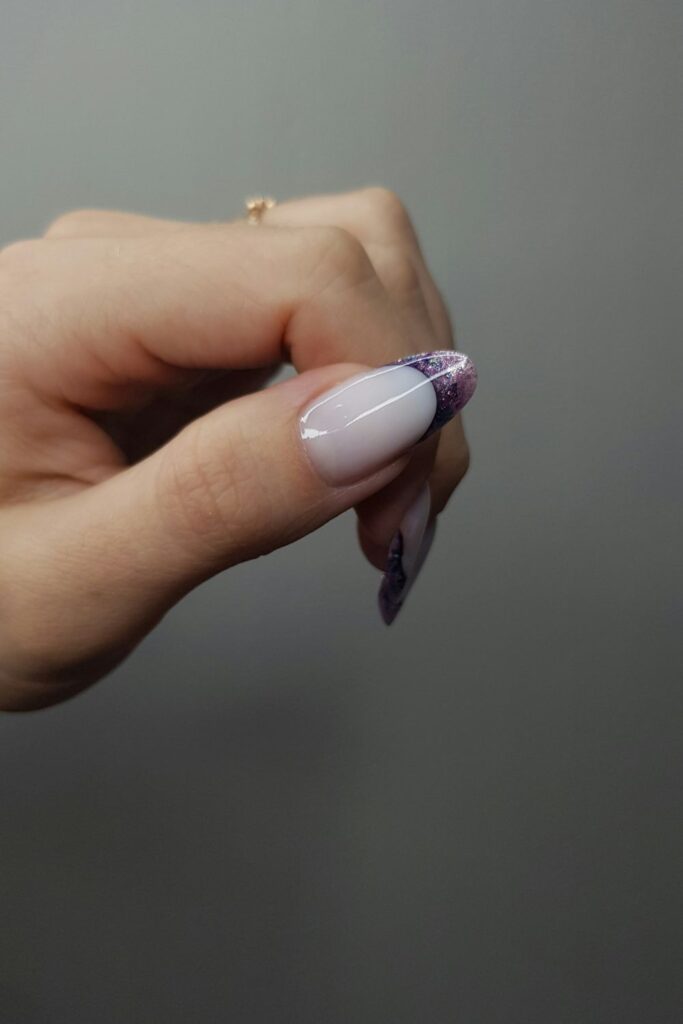10 Easy Nail Art Ideas for Beginners You Can Try at Home 10 Easy Nail Art featuring a glossy nude nail with a dark purple French tip.