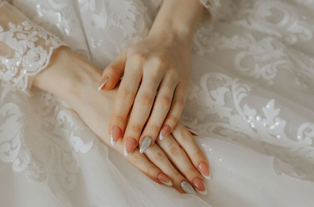 Nail tips nails with an elegant nude manicure and natural-looking finish.